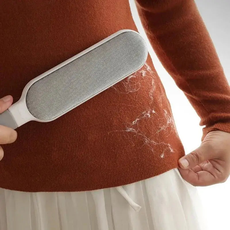 Brosse électrostatique anti-poils enlevant poils sur vêtements en laine orange